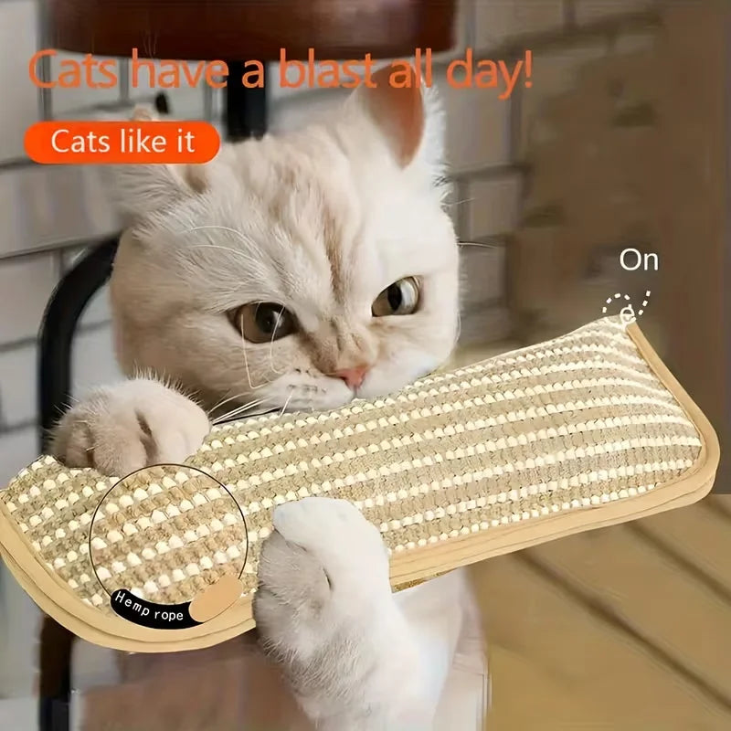 A white cat is playing with a sisal rope toy and pillow set.