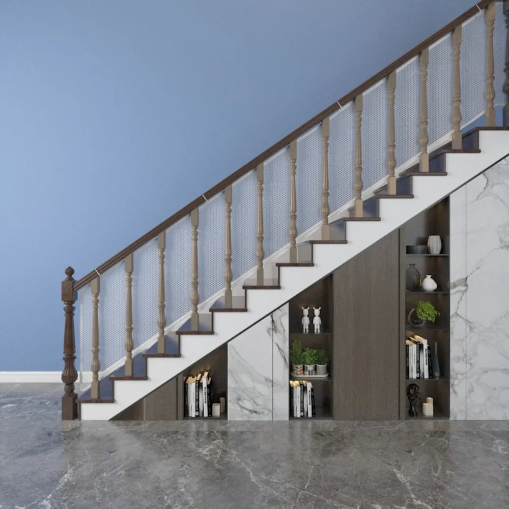 A modern interior featuring a staircase with wooden railings and glass mesh safety barriers against a light gray wall.