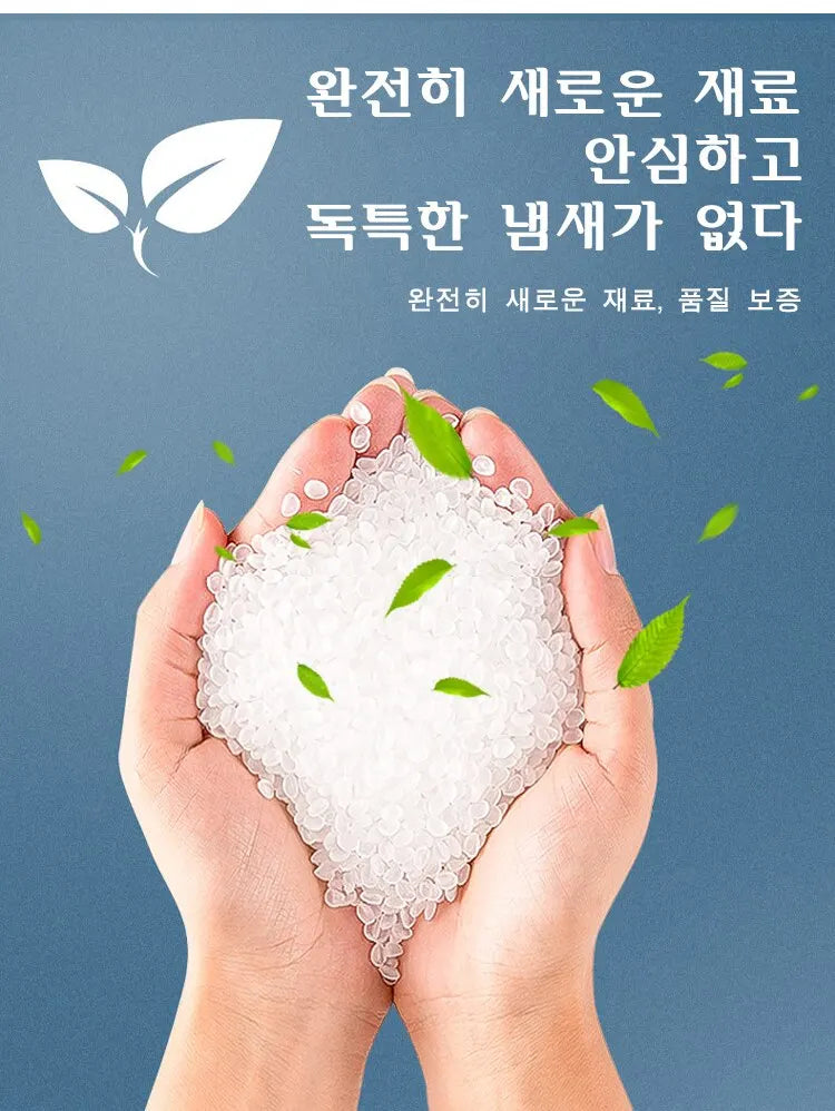 Hands holding a white, granular product with green leaves floating around it.