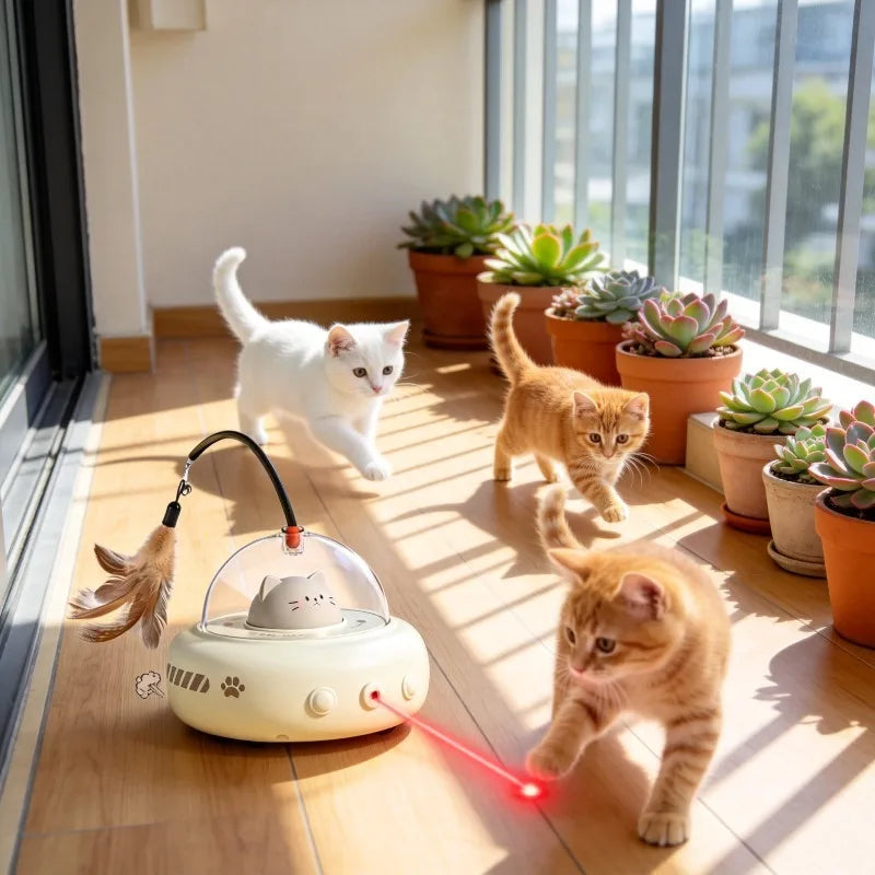 An orange kitten plays with an interactive UFO cat teaser wand that emits a red light and feathers.