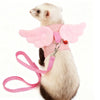 A light gray pet harness with pink wings and a pink leash, worn by a small rodent.