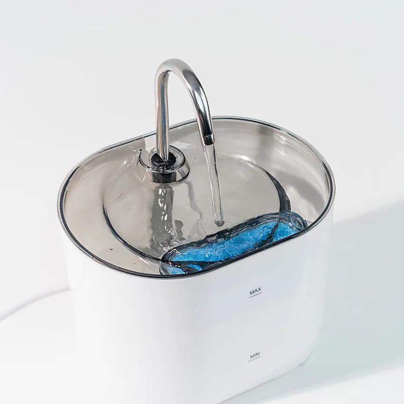 Stainless steel cat water fountain with an automatic sensor and filtration system.