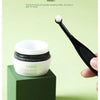 A black brush is shown next to a white jar of Pet Tear Stain Remover brush for dogs and cats.