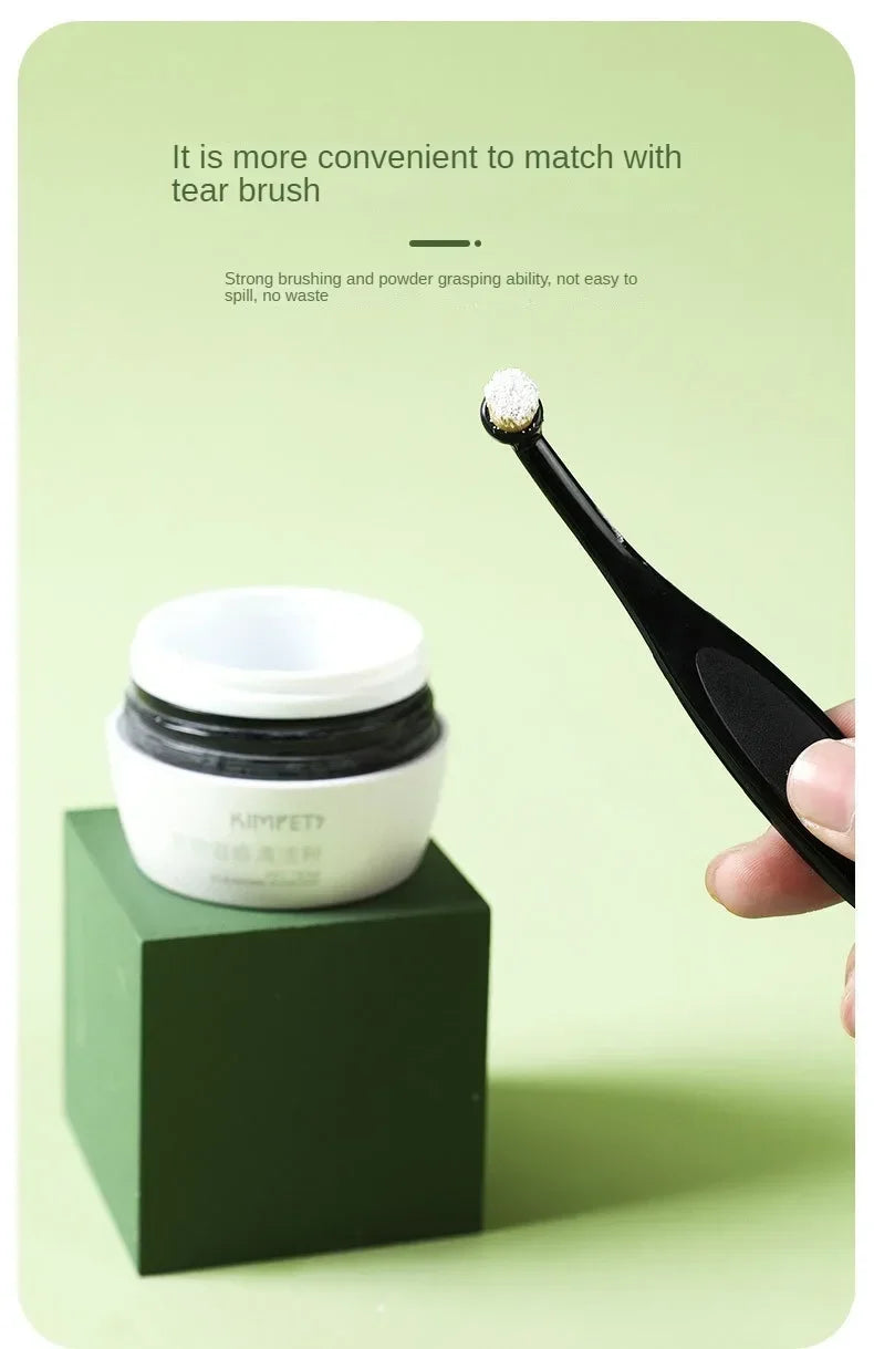 A black brush is shown next to a white jar of Pet Tear Stain Remover brush for dogs and cats.