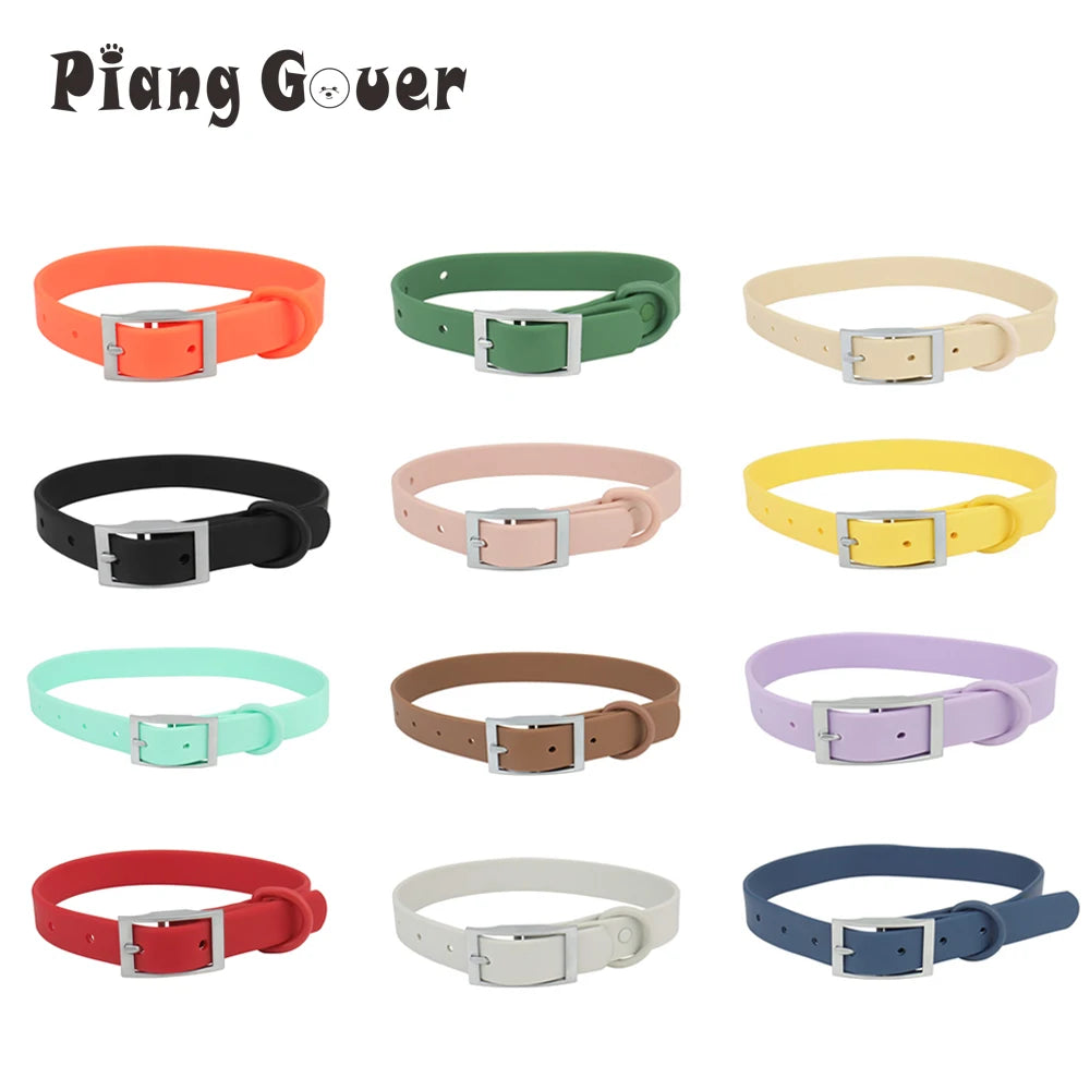 A collection of eight adjustable PVC pet collars in various candy colors, including orange, green, yellow, pink, and blue.