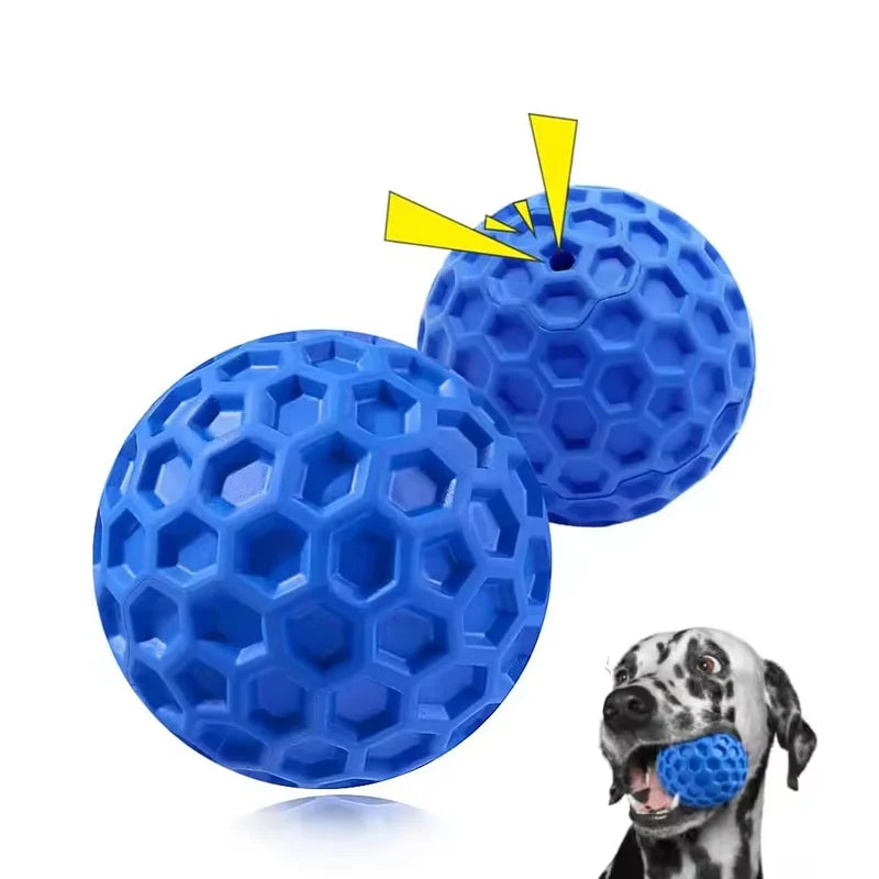 A blue honeycomb squeaky dog toy ball is shown next to a dog's head.