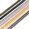 A set of multiple strands of gold and silver plated ball necklaces displayed diagonally.