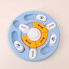 Jouet distributeur de puzzles bleu clair pour chiens et chats avec diverses formes et textures.