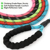 A coiled reflective nylon dog leash with a padded handle shown in various colors and a detached leash section.