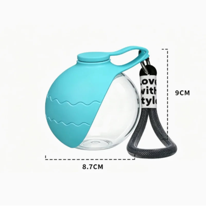 A teal foldable travel pet water bottle with a silicone spout and a black hook for carrying.