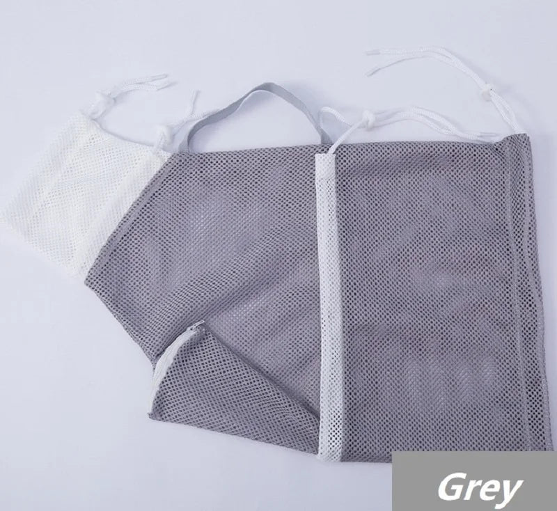 Grey mesh grooming bag with white trim and a white mesh pouch for pet use
