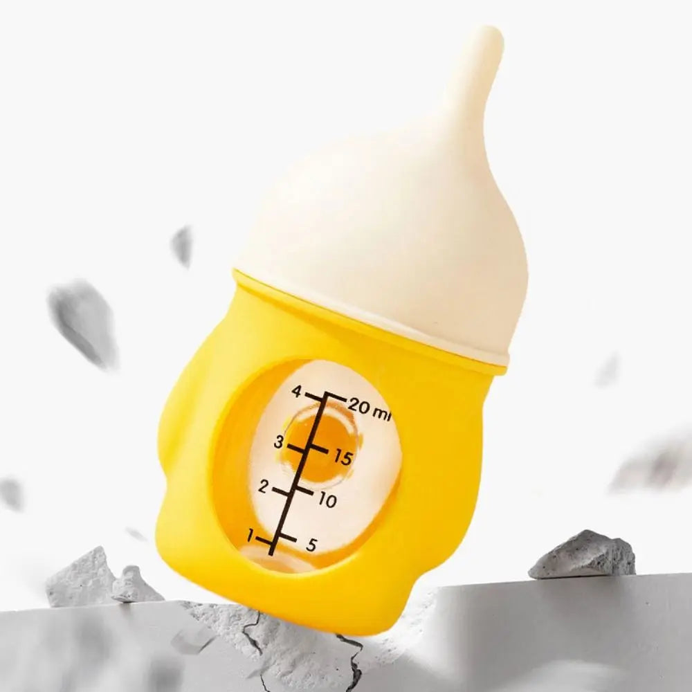 A yellow silicone pet nursing bottle with an anti-choking valve and volume markings is shown against a white background.