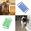 A set of blue and green interactive spring toys for cats, including a coiled toy and a cat playing with one.