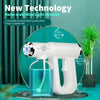A white portable steam gun is shown next to a glass of water, demonstrating nano-scale blue light atomization for indoor air 