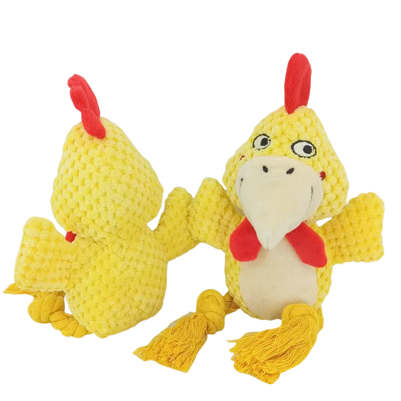 A yellow plush toy resembling a chicken or bird with red features and yellow feet.