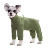 A small, fluffy dog wearing a olive green thermal fleece jumpsuit.