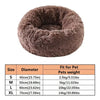 A round, fluffy brown pet bed designed for dogs and cats.