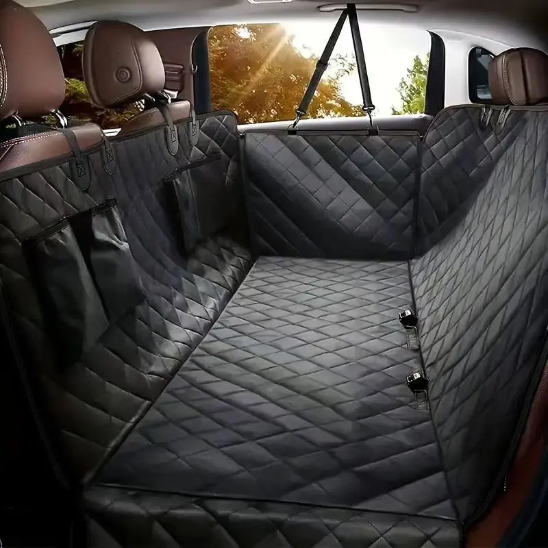 A dark gray quilted waterproof dog car seat cover installed on the back seats of a vehicle.