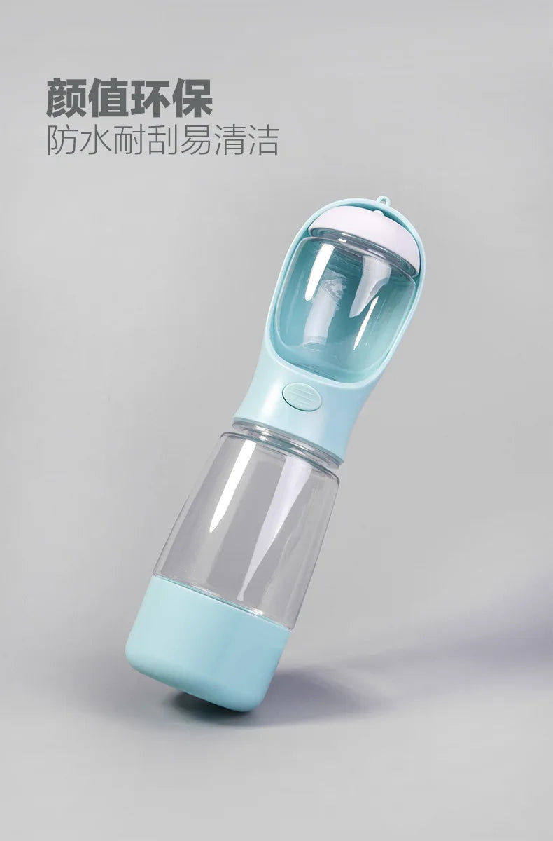 A clear and light blue portable pet water bottle with a leak-proof travel dispenser top.