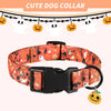 An orange patterned pet collar with a black buckle and a Halloween pumpkin charm.