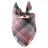 A plaid bandana featuring shades of pink, black, and brown with fringed edges.