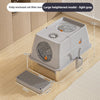 A large heightened light gray fully enclosed cat litter box with a stainless steel flip-top lid shown on a wooden floor.