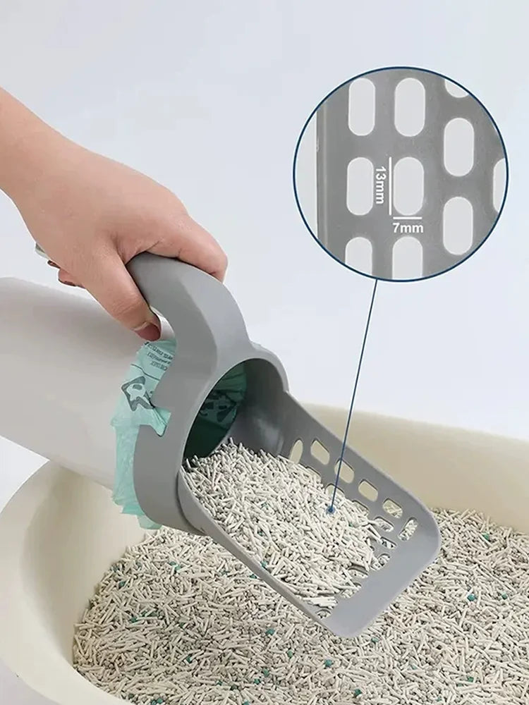 A hand is using an integrated pet waste scoop and cleaner to scoop dry pet waste from a bowl.