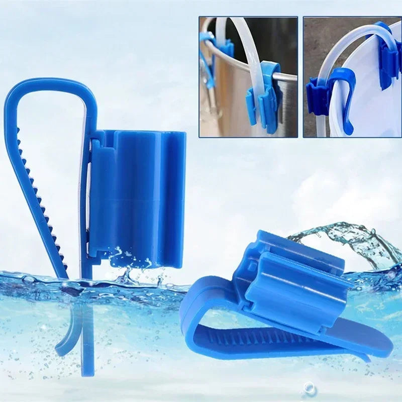 Blue aquarium siphon hose clip tool being used to remove water from a container.