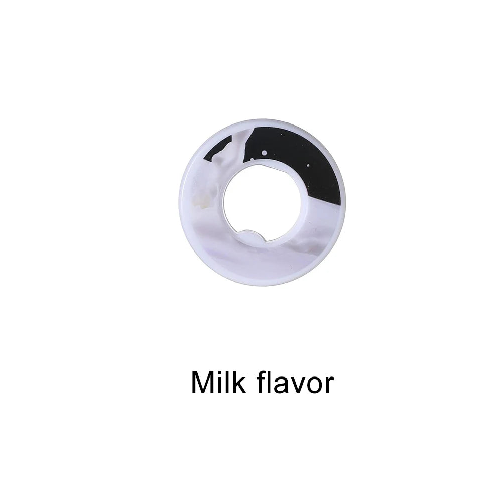 A white flavor pod for water bottles with a black ring, labeled Milk flavor.