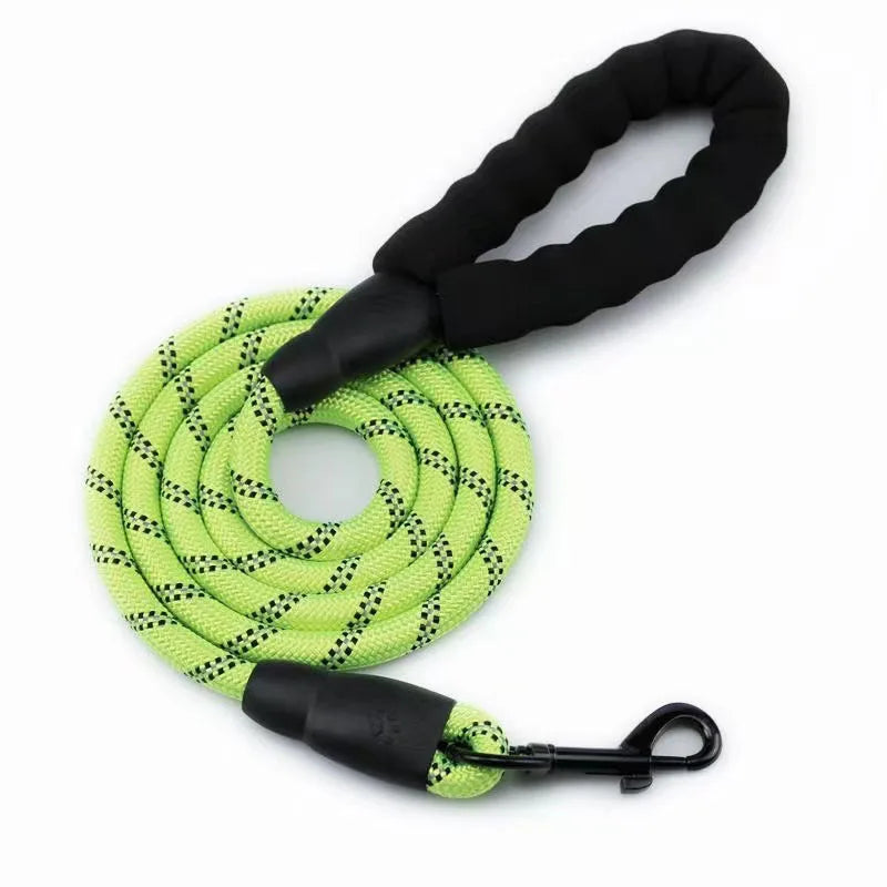 A bright lime green reflective dog leash with a black padded handle and metal clip.