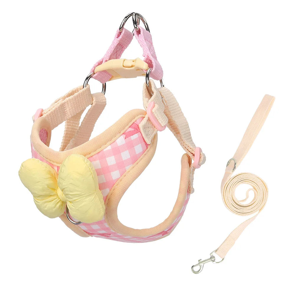 Pink and yellow plaid dog harness with a bow for small breeds