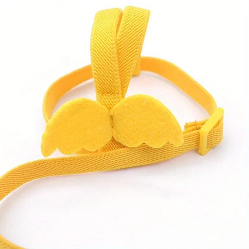Yellow ultra-light parrot flying harness with a strap and two soft, padded attachments