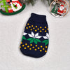 Navy knitted winter dog sweater featuring white floral and yellow star patterns