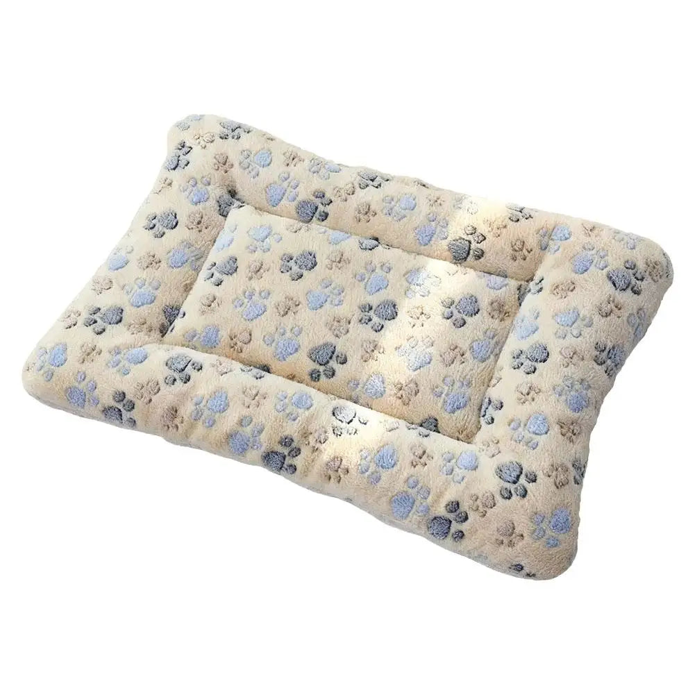 A plush double-sided pet blanket or cozy washable mat for cats and small dogs with a light beige and blue floral pattern.