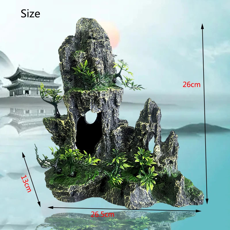 A dark gray resin rockery featuring a cave opening and small green trees, shown with size measurements.