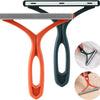 Orange and dark green double-sided brush for removing fabric and pet hair