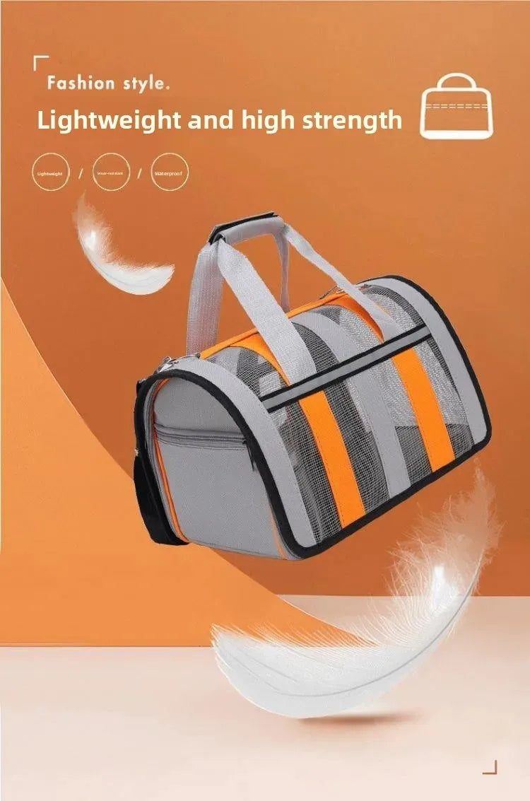 A gray and orange foldable mesh pet carrier with a shoulder strap is shown against an orange background.