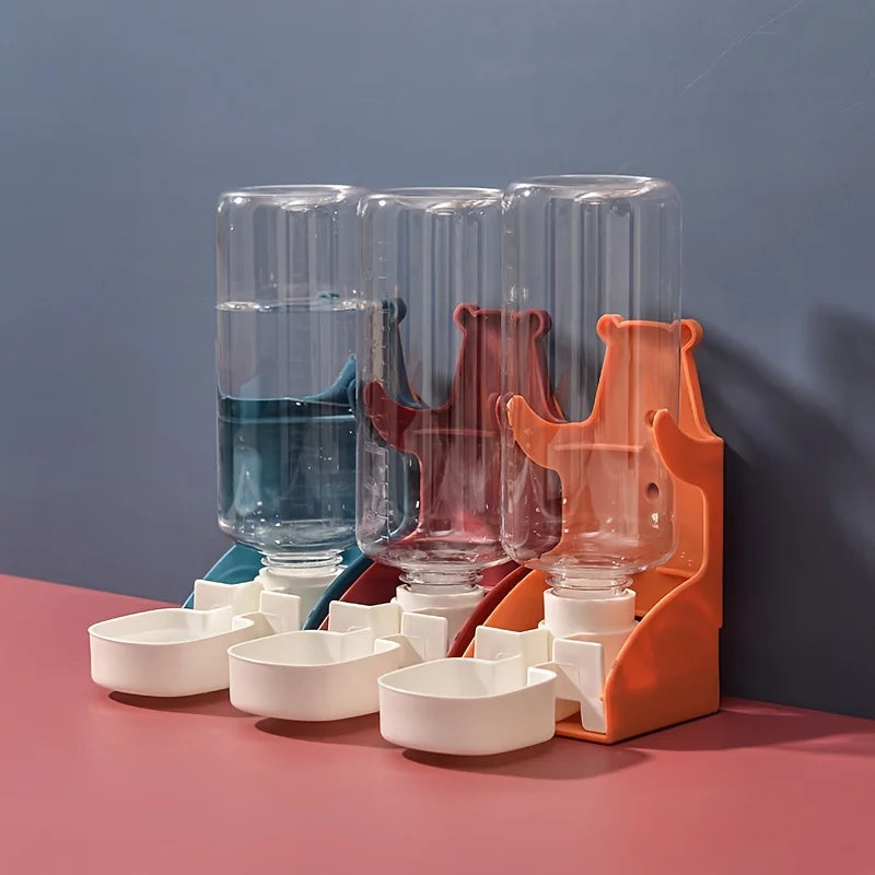 Three clear glass bottles with orange and blue liquid are displayed in an orange holder on a pink surface.