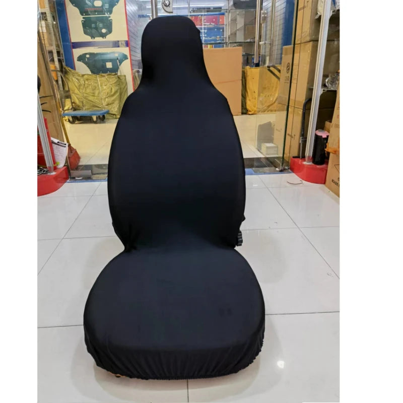 A black breathable stretch car seat cover for the front seat, displayed in a glass cabinet.