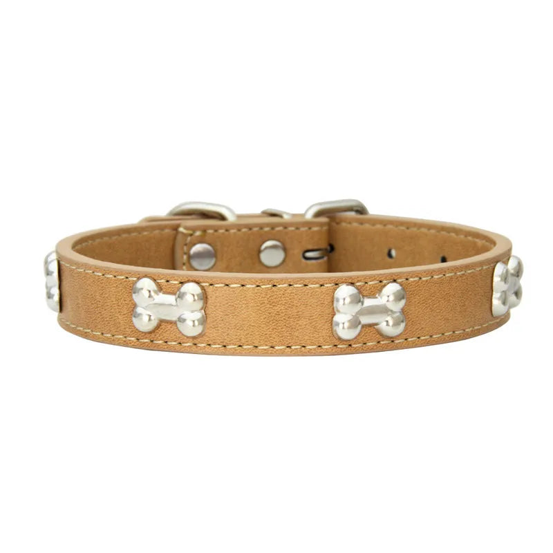 A tan leather dog collar with silver hardware and a woven pattern.