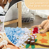 A yellow pet blanket with various fabric pieces and toys for dog sniffing training.
