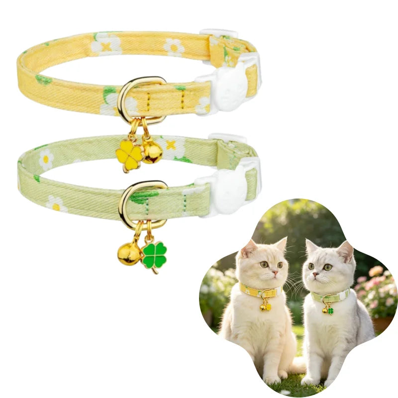 A yellow floral breakaway cat collar with a bell and a light green floral breakaway cat collar with a bell.