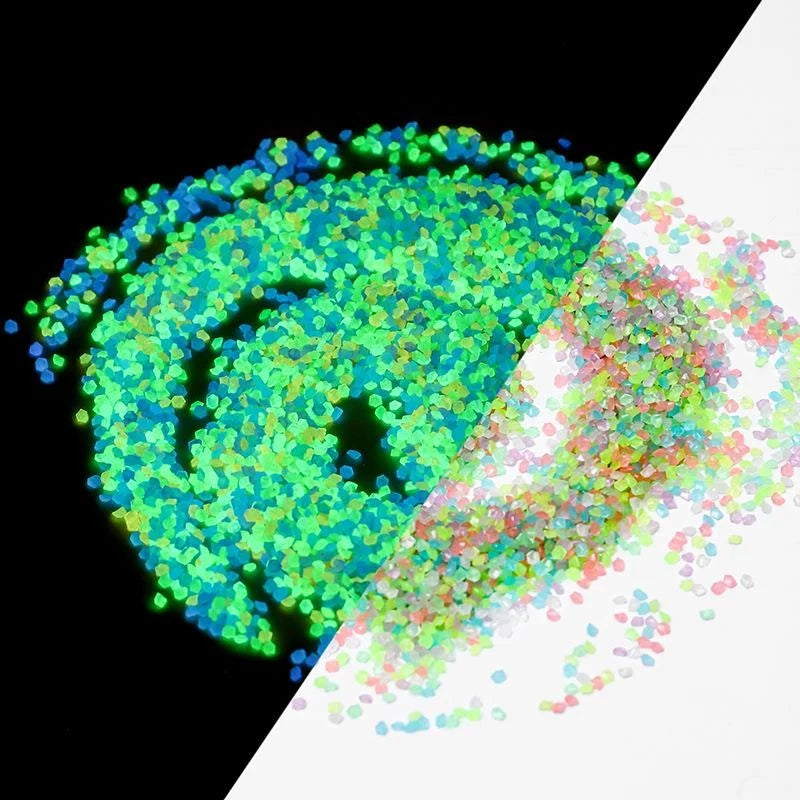 A split image showing a glowing green cluster of particles on the left and a scattering of pink and green particles on the ri