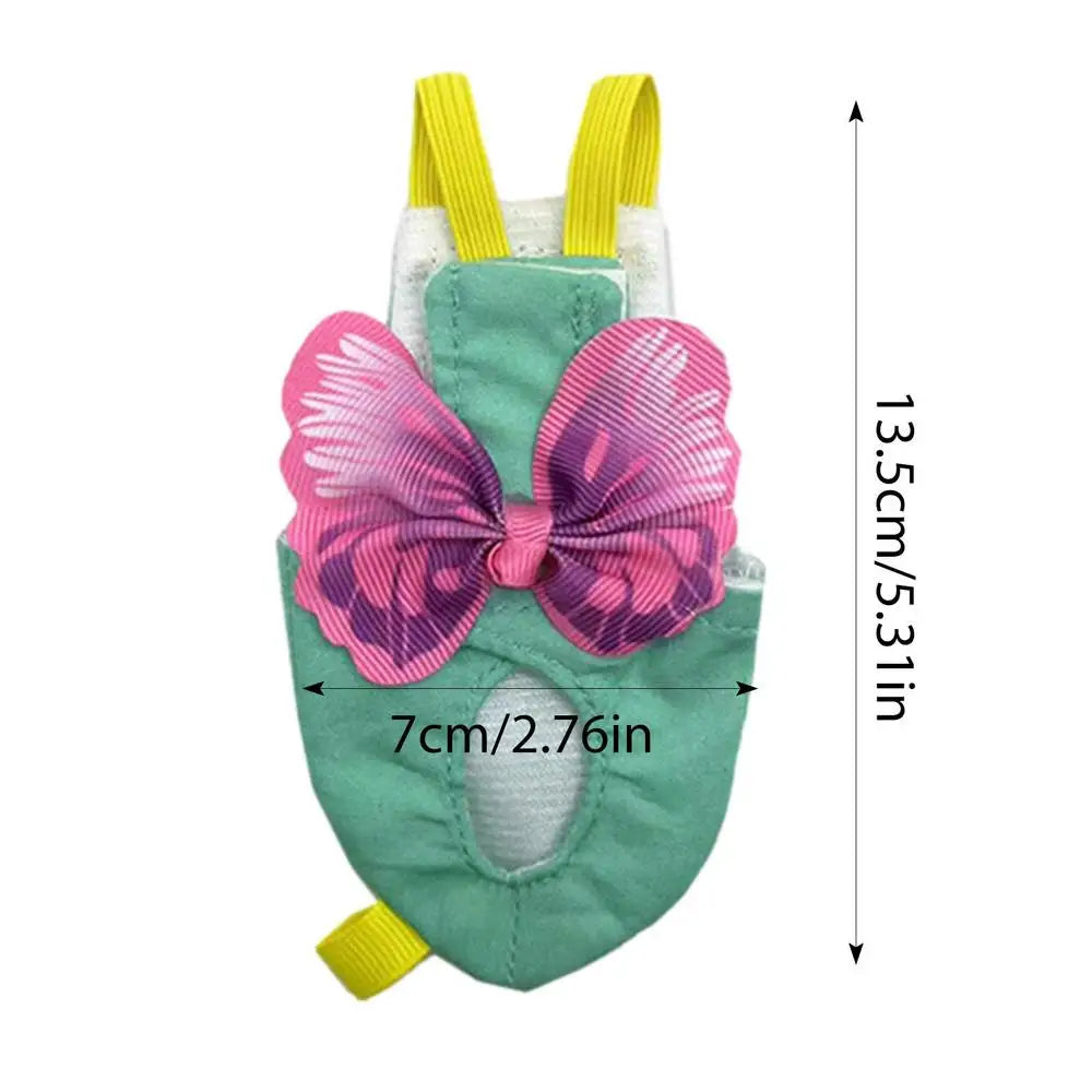 A soft reusable parrot flight suit in green with pink butterfly accents and yellow straps.