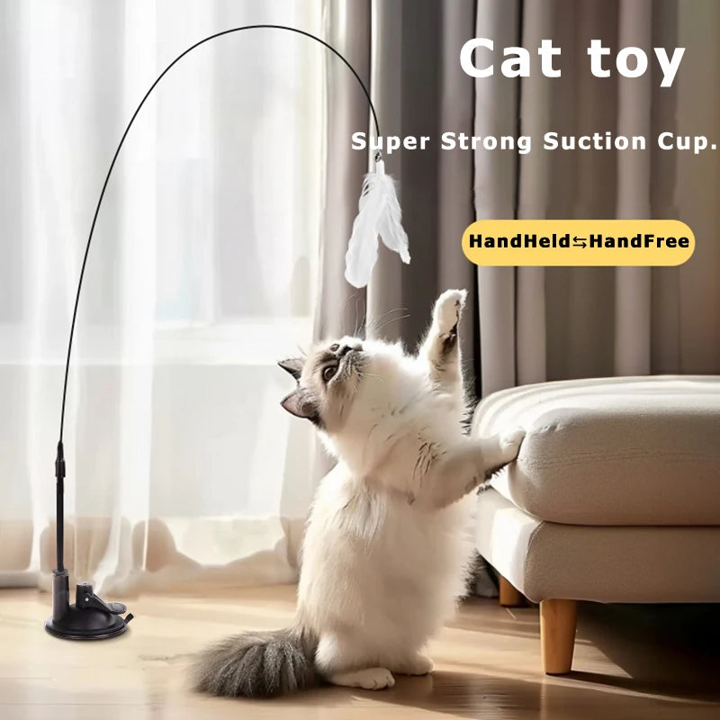 A white cat playing with a long, thin suction cup toy designed for cats.