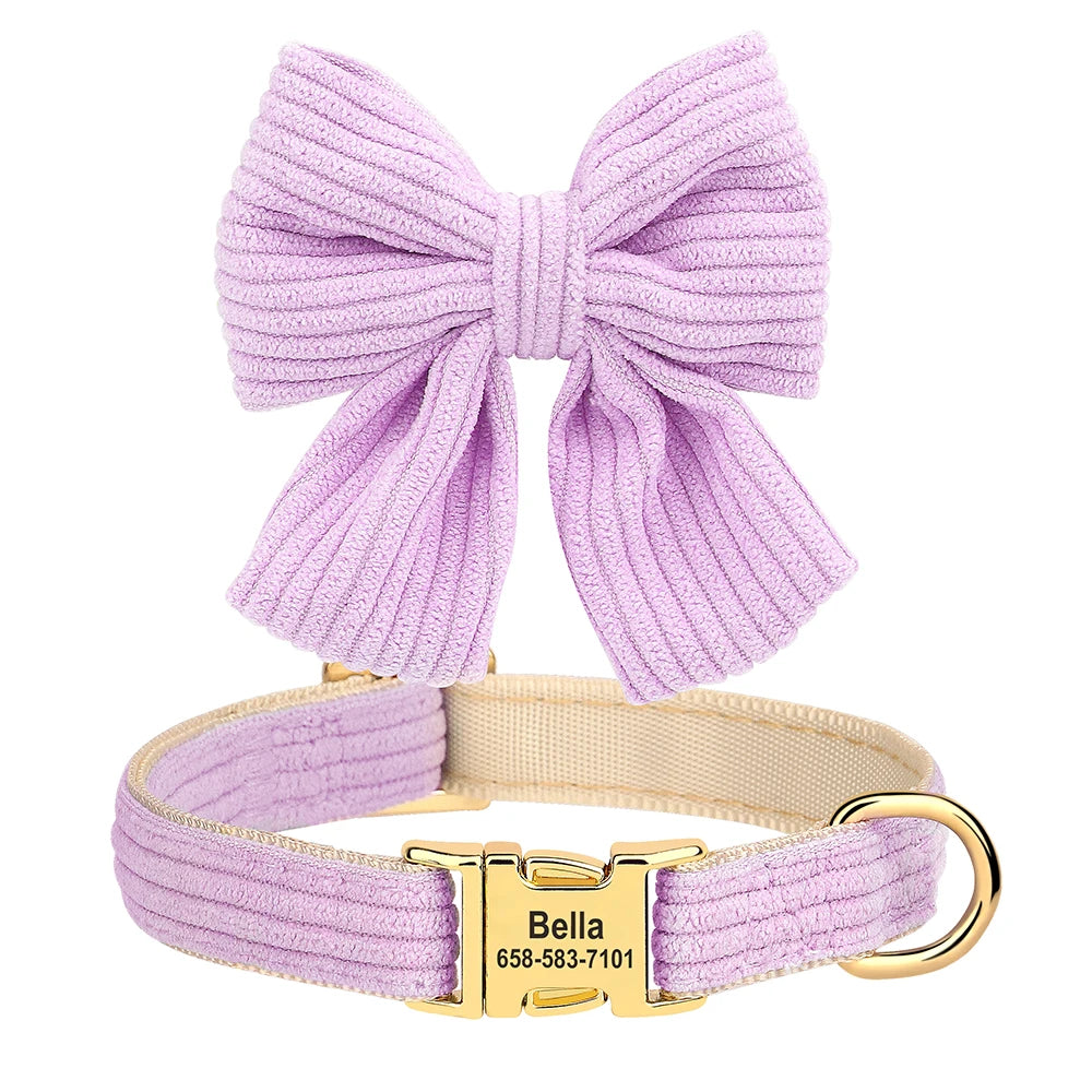 A lavender velvet dog collar with a large bow knot and gold buckle.