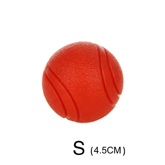 A bright red rubber dog ball labeled size S with a diameter of 4.5 cm.