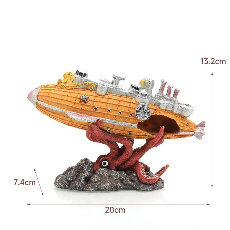 A model of a sunken submarine with a hideout cave and a red dragon on a rock display.