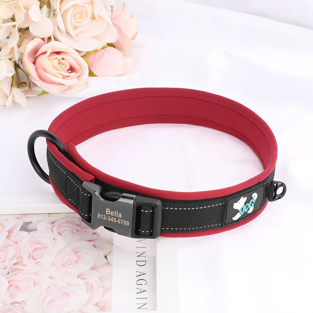 A red reflective dog collar with a black buckle and a small dog silhouette tag is displayed on a white surface.