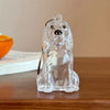 Clear glass keychain featuring a dog design, depicting a seated dog with floppy ears and a collar.